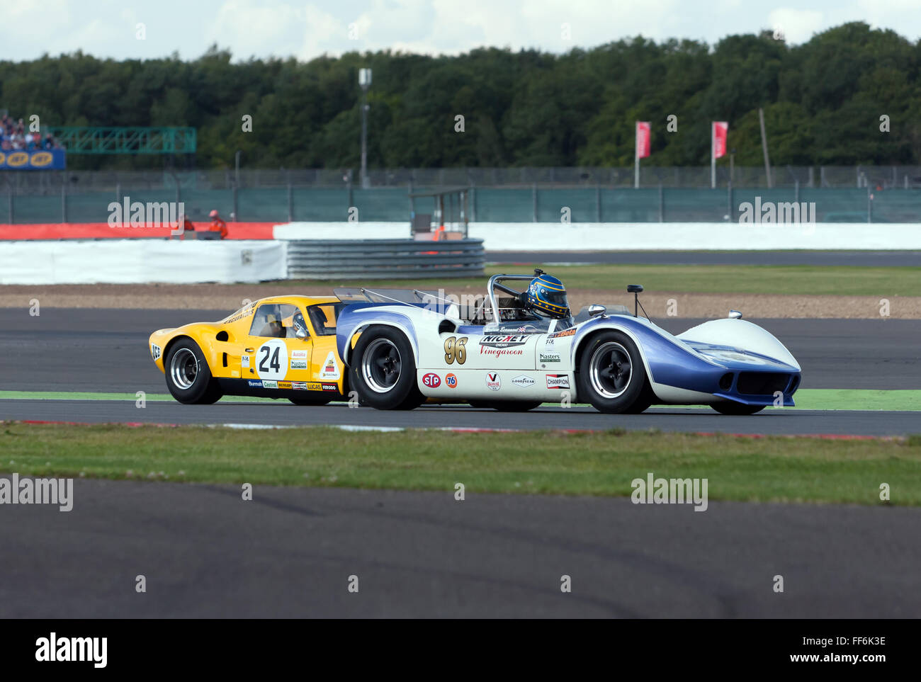 A McLaren M1B leads a Chevron B8, during the FIA Masters Historic Sports Cars race at the 2015 Silverstone Classic. Stock Photo