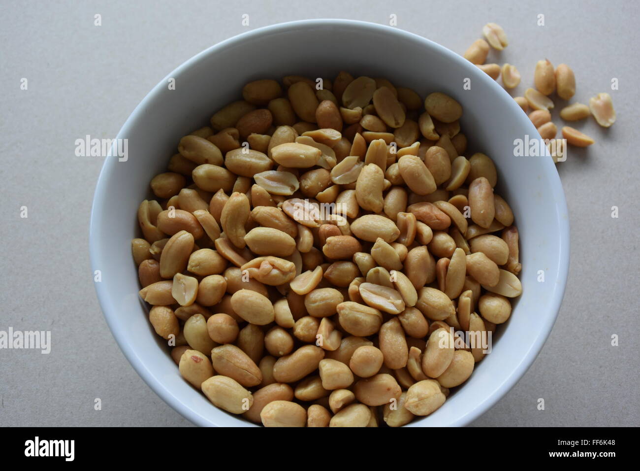 a lot of peanuts in a dish Stock Photo