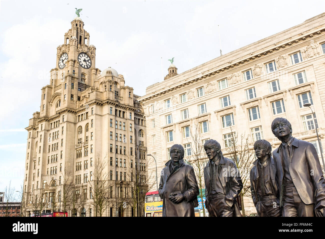 The Beatles statues at the pier head in Liverpool, UK with the Royal LIver Building in the background Stock Photo