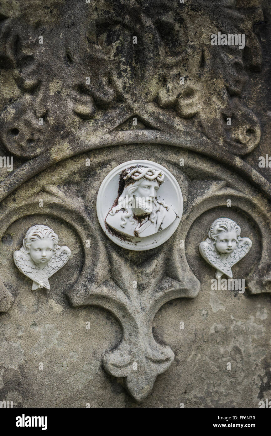 jesus with crown of thorns and two angels, tombstone relief Stock Photo