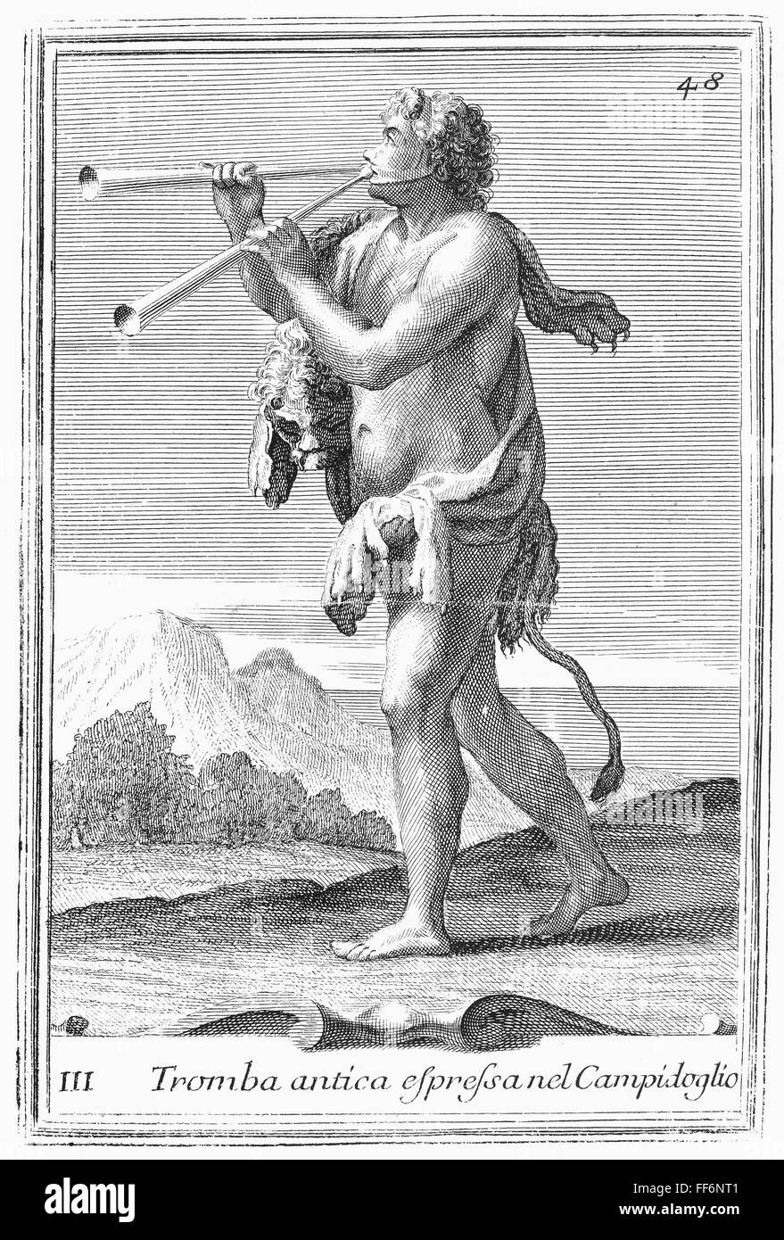 DOUBLE AULOS. /nMan playing a double aulos, an ancient reed instrument