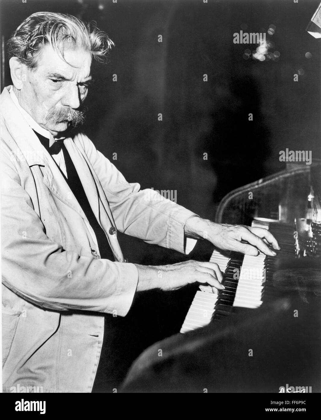 ALBERT SCHWEITZER /n(1875-1965). French Prostestant clergyman, philosopher,  physician, and music scholar. Shown at his zinc-lined piano (with pedal  keyboard attachment) in the hospital village of Lambarene, French  Equatorial Africa (present-day Gabon Stock