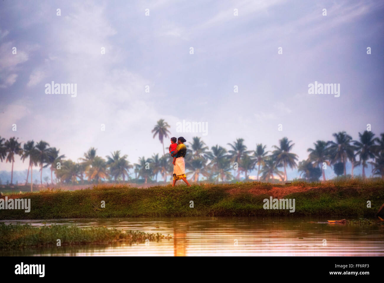 a woman with her baby in Alappuzha, Backwaters, Kerala, South India, Asia Stock Photo