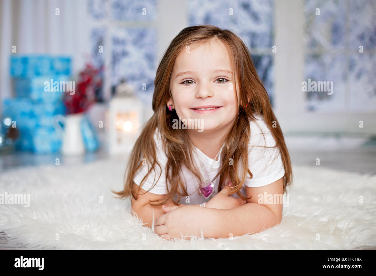Beautiful winter close portrait of little preschool girl at home ...