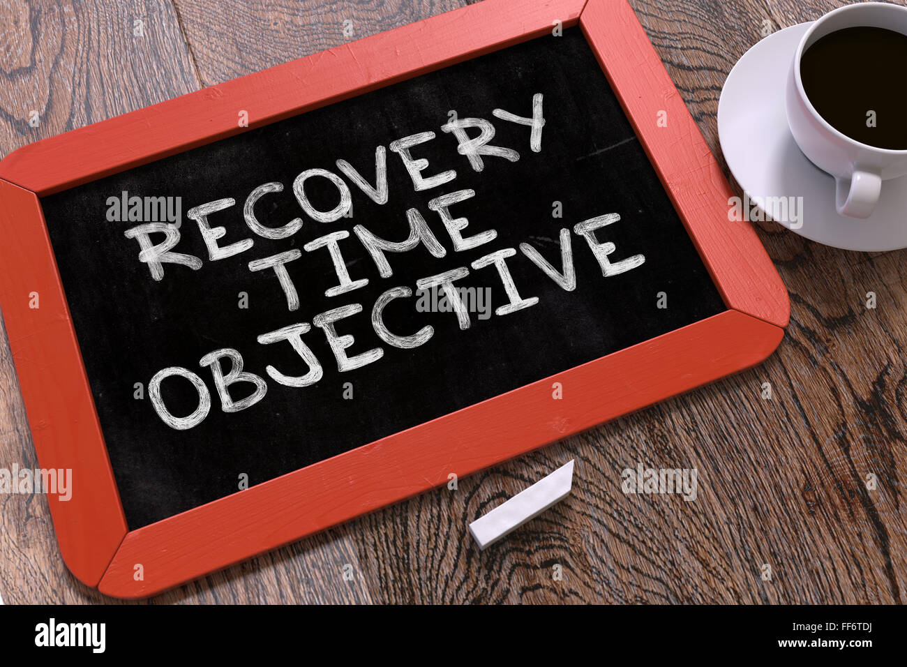 Recovery Time Objective Handwritten by white Chalk on a Blackboard. Stock Photo