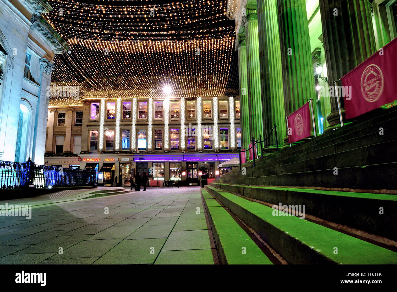 Royal Exchange Square in Glasgow city centre lit up at night Stock