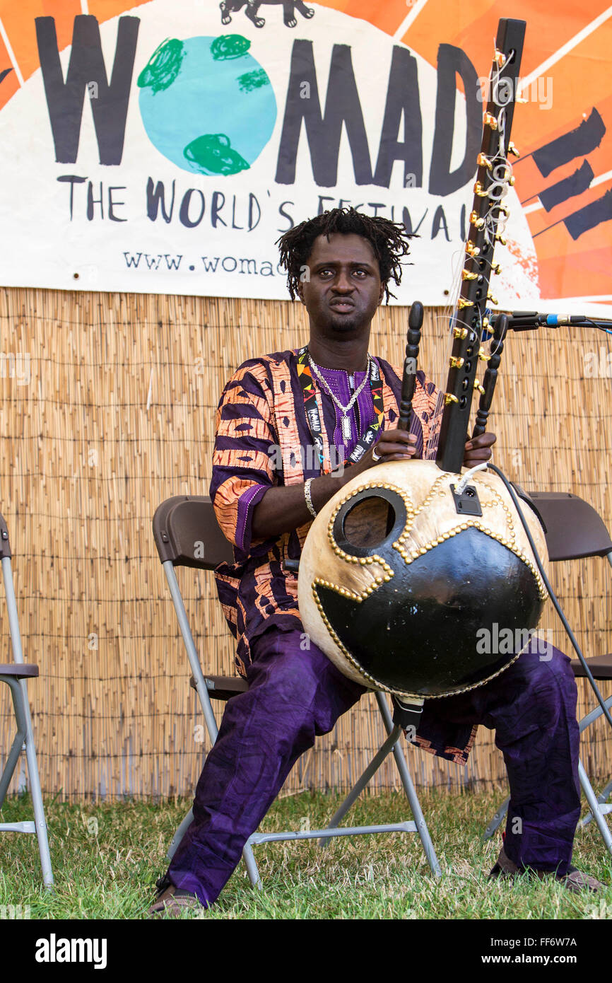 Jali Bakary Konteh playing the Kora performing on the live acoustic stage  for Radio Womad. WOMAD 2014, festival of world music and dance, Charlton  Park, Wiltshire. UK Stock Photo - Alamy