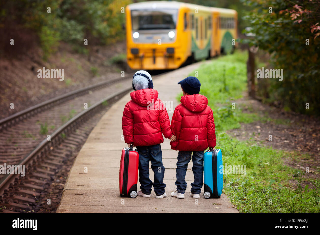 Two boys on a railway station, waiting for the train with suitcases Stock Photo 95424018 Alamy Two boys on a railway station, waiting for the train with suitcases Stock Photo 95424018 Alamy