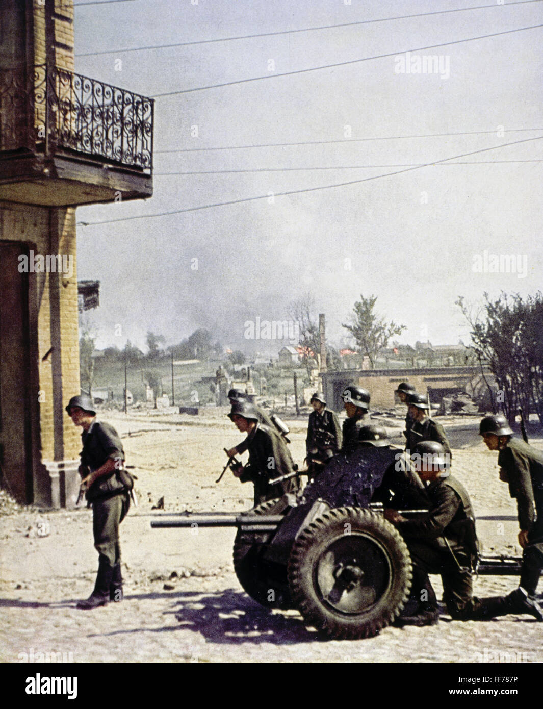 events, Second World War / WWII, German Wehrmacht, infantry with 3.7 cm anti-tank gun Pak 36, circa 1940, gunners, crew, Germany, Third Reich, 20th century, historic, historical military, guns, burning, village, town, street, soldiers, people, 1940s, Additional-Rights-Clearences-Not Available Stock Photo