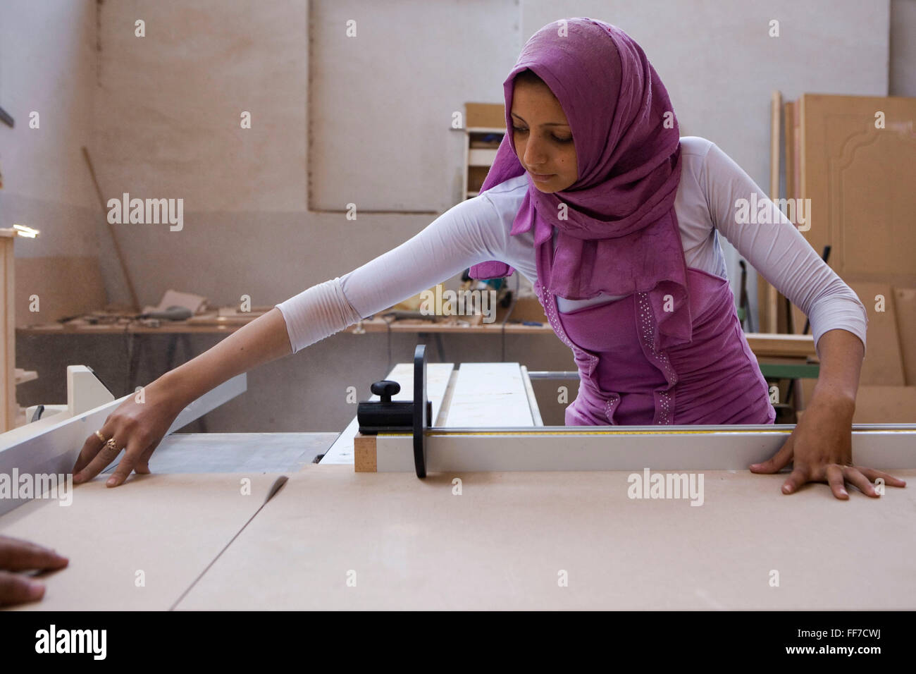 A woman learns new skills through the a NHASD Program, in Egypt. Women are taught vocational and practical skills, such as, baking, teaching and carpentry. This gives them the opportunity to earn money in the future, which is crucial as poverty is becoming more widespread in rural areas of Upper Egypt, and especially and among female-headed households. Stock Photo