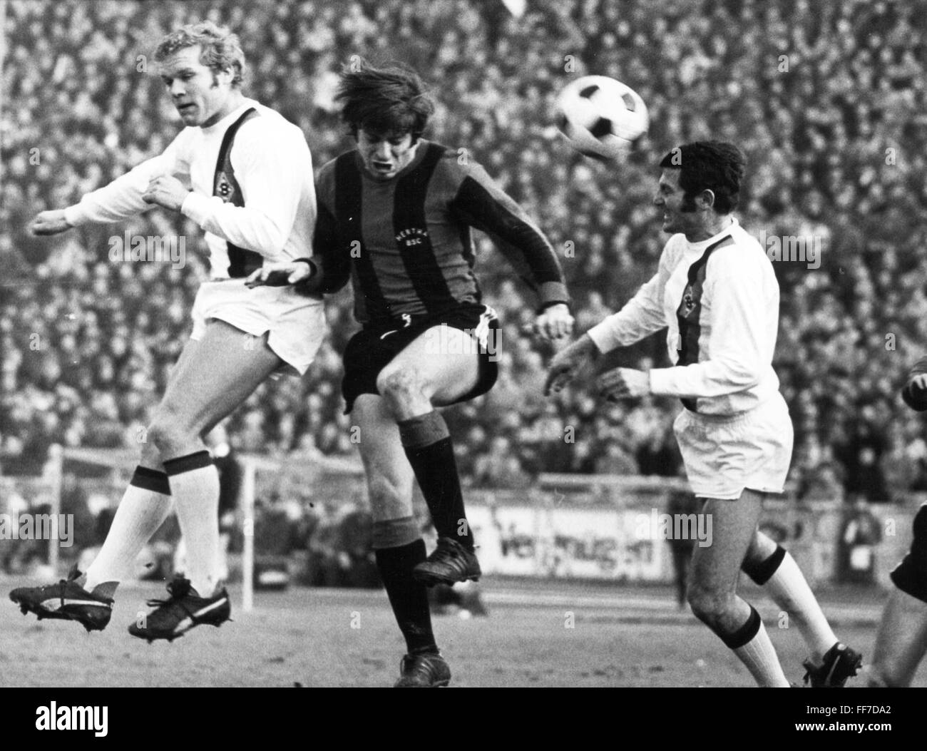 sports,football,games,Germany,DFB-Pokal,1970 / 1971,second round,game Herta BSC versus Borussia Moenchengladbach(1: 3),header duel between Klaus-Dieter Sieloff,Lorenz Horr and Ludwig Mueller,Olympic stadium,Berlin,20.2.1971,DFB cup,athletes,athlete,footballer,footballers,kicker,football player,football players,action,act,actions,acts,header,header shot,headers,header shots,duel,duels,struggle,sports stadium,sports stadiums,West Germany,Western Germany,Germany,West Berlin,1970s,70s,20th century,people,men,man,group,g,Additional-Rights-Clearences-Not Available Stock Photo