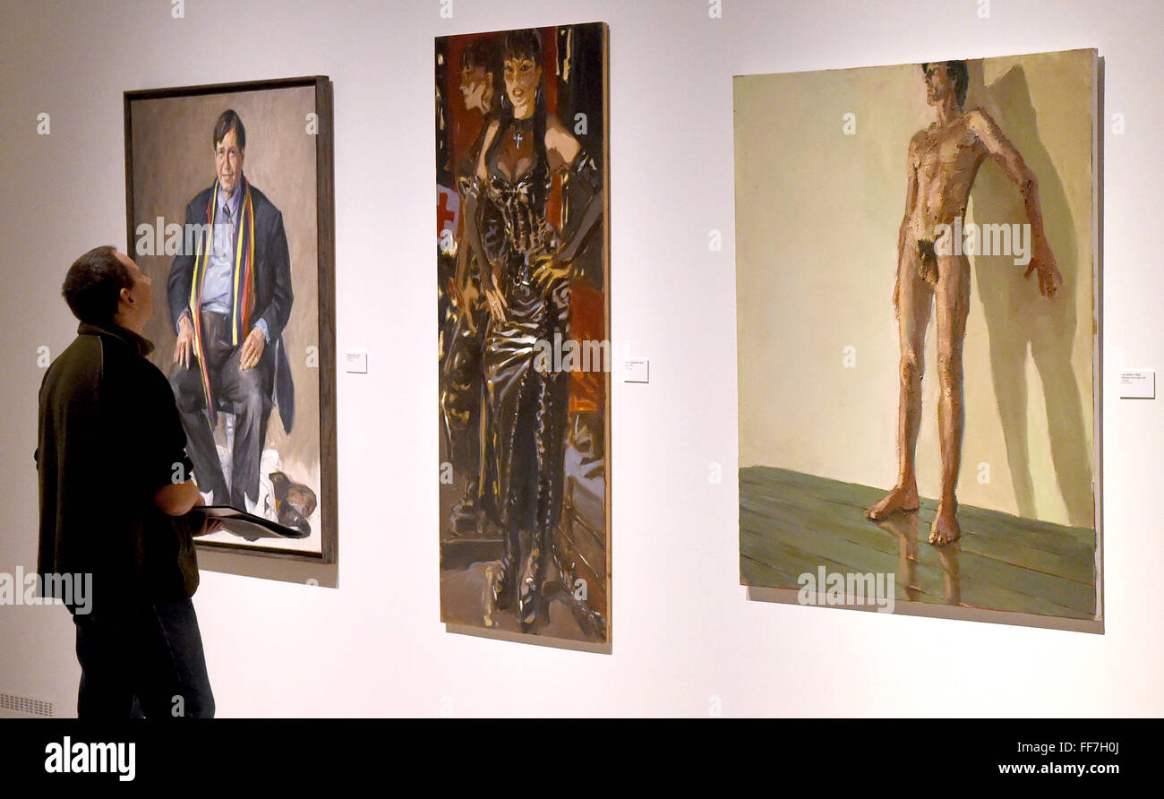 Schleswig, Germany. 11th Feb, 2016. A visitor looks at the paintings (L-R) 'Johannes Duve' by Steven Paul, 'Domina' by Hinnerk Bodendiek and 'Maennlicher Akt an der Wand' by Lars Moeller at the special exhibition 'Best Friends - Artworks from Gottorf palace' in Schleswig, Germany, 11 February 2016. The exhibition runs until 5 Jaune 2016. Photo: Carsten Rehder/dpa/Alamy Live News Stock Photo