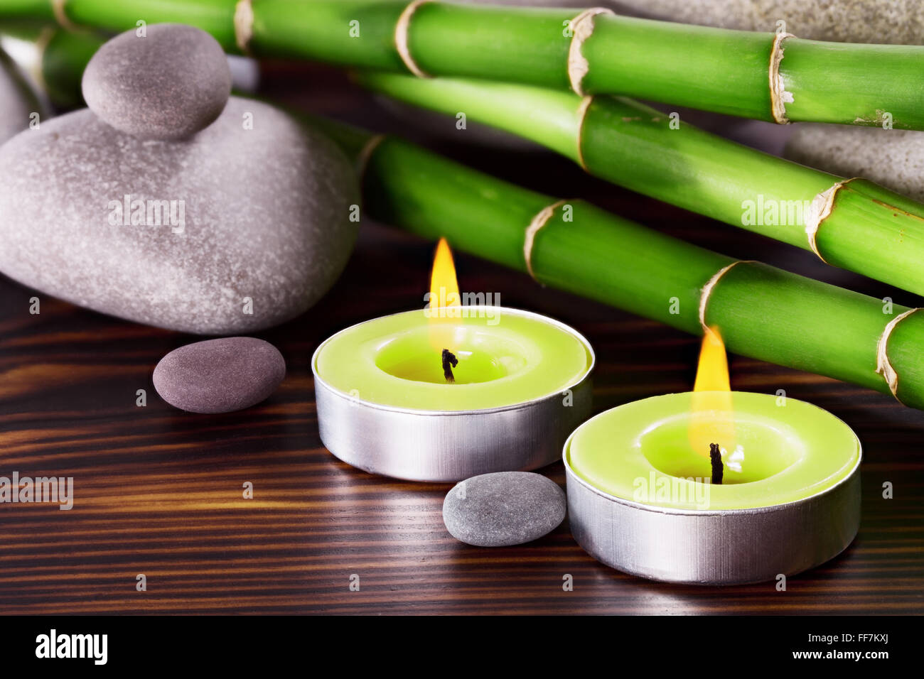 Spa Stones with bamboo on a wooden surface Stock Photo