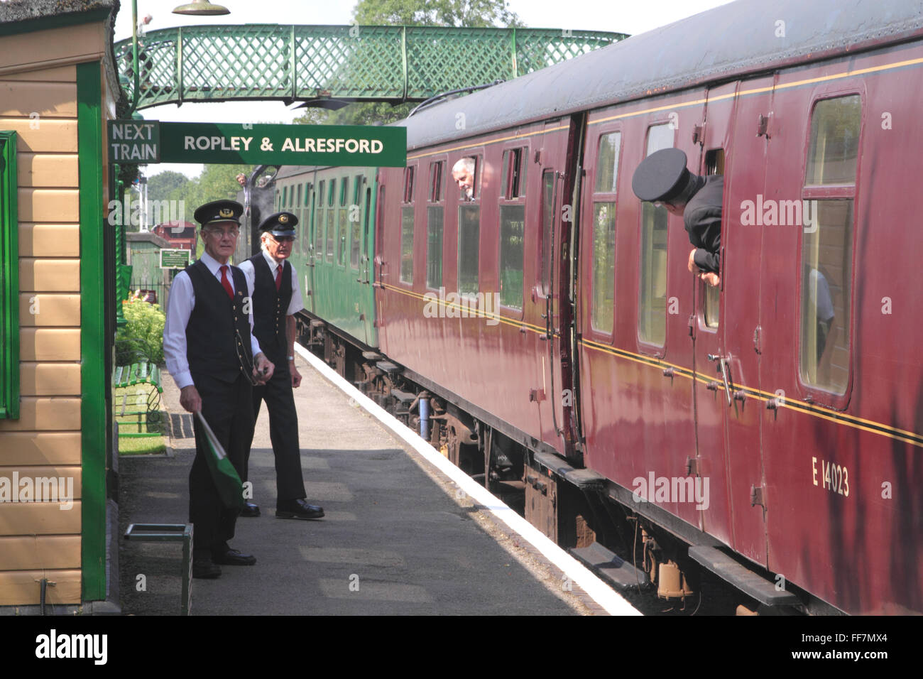 Guards at Medstead and Four Marks station on the Mid Hants preserved steam railway Stock Photo
