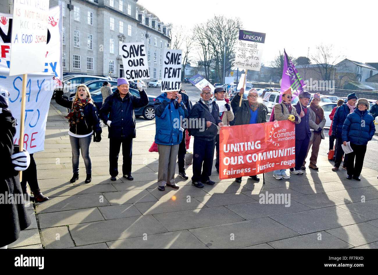 Maidstone, Kent, UK. 11th February, 2016. Protesters gather outside County Hall in Maidstone to greet Kent County Councillors before a vote on a budget including a 4% Council Tax rise and £80m pounds in cuts. Members of Unite are joined by campaigners against the closure of Pent Valley School, Folkestone and the Dorothy Lucy Day Care Centre Credit:  PjrNews/Alamy Live News Stock Photo