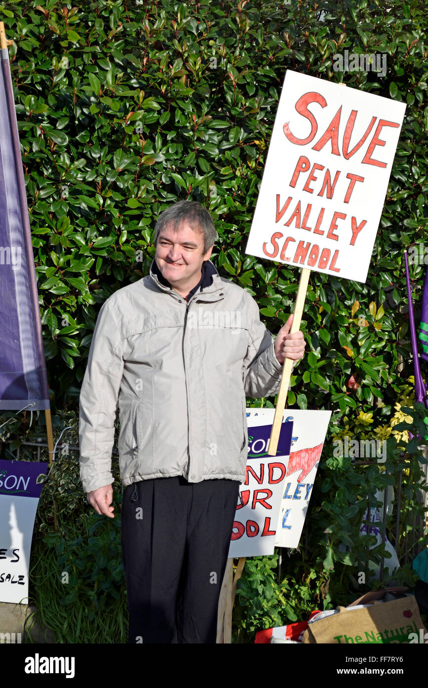 Maidstone, Kent, UK. 11th February, 2016. Protesters gather outside County Hall in Maidstone to greet Kent County Councillors before a vote on a budget including a 4% Council Tax rise and £80m pounds in cuts. Members of Unite are joined by campaigners against the closure of Pent Valley School, Folkestone and the Dorothy Lucy Day Care Centre Credit:  PjrNews/Alamy Live News Stock Photo