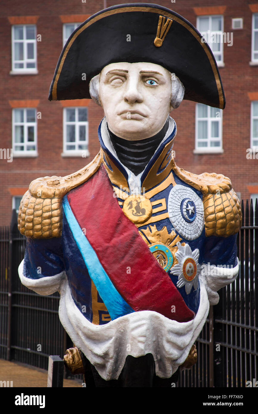 Admiral Lord Horatio Nelson figure head. Standing at about 9ft (2.7m), the wooden bust which once adorned the bows of HMS Trafalgar is on show alongside HMS Victory in Portsmouth's dockyard. Stock Photo