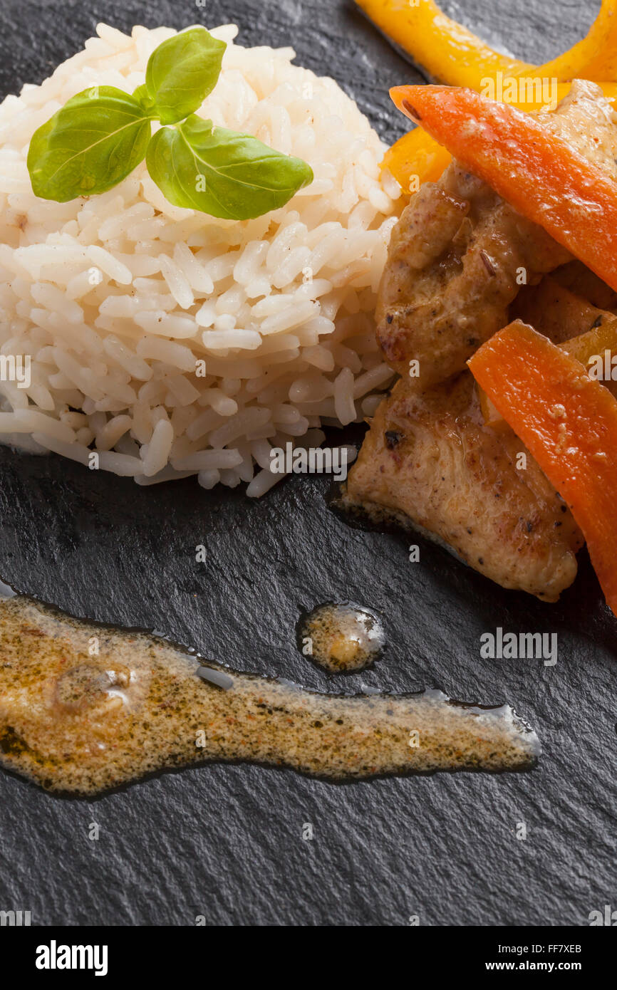 Slate Rice asian chicken dish on slate plate with rice Stock Photo - Alamy