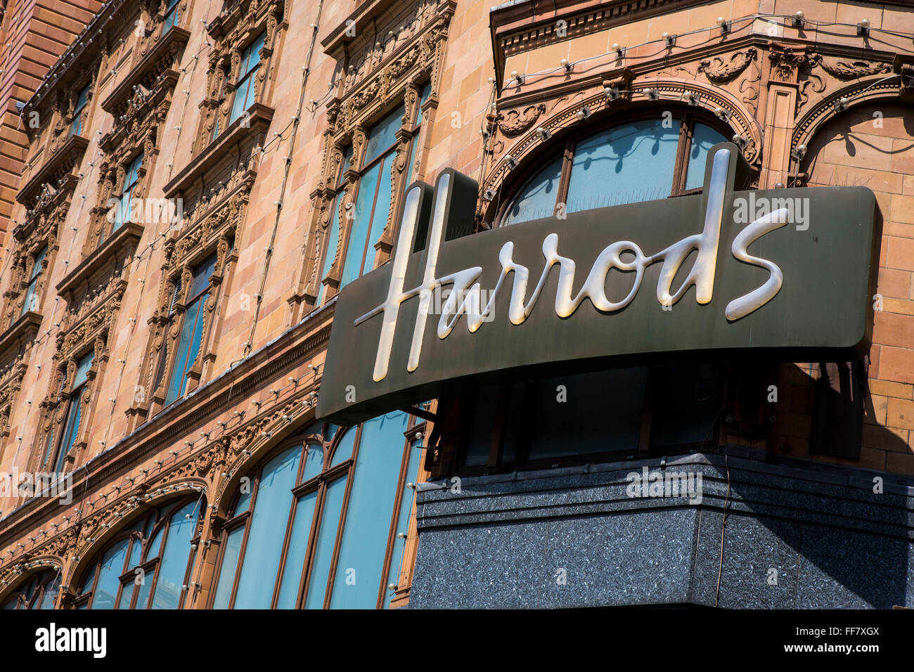 The iconic Harrods sign on the store building in Knightsbridge, London, United Kingdom. Stock Photo