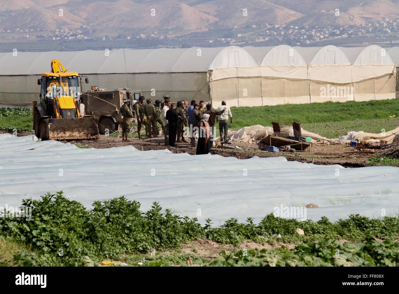 Tubas, West Bank, Palestinian Territory. 11th Feb, 2016. Israeli bulldozers demolish Palestinian homes in the Jordan valley, near the West Bank town of Tubas on February 11, 2016. Israel is planning to annex the Jordan Valley into a completely Israeli area, primarily in agriculture, targeting to ban territorial contiguity between a future Palestinian state and the rest of the Arab world Credit:  Nedal Eshtayah/APA Images/ZUMA Wire/Alamy Live News Stock Photo