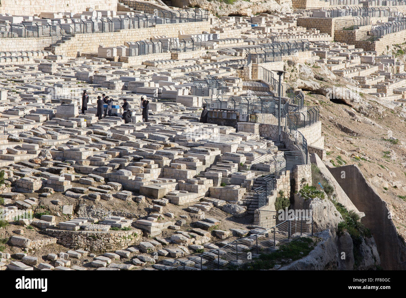 JERUSALEM, ISRAEL - MARCH 3, 2015:  The jewish cemetery on the Mount of Olives and burial of orthodox Jews. Stock Photo