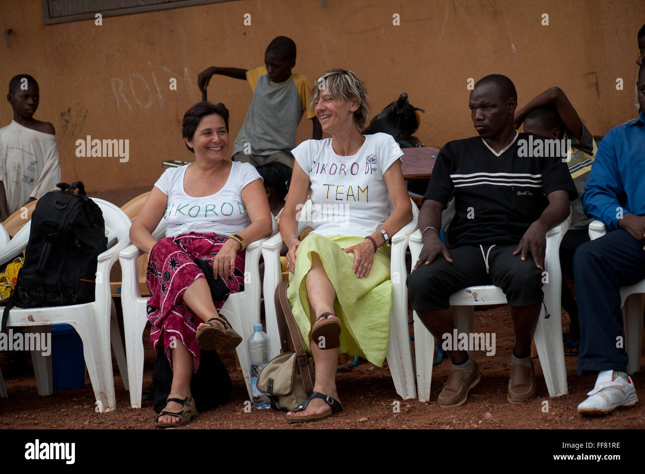 Mali, Africa - Mature caucasian women having fun watchingsiy a soccer
