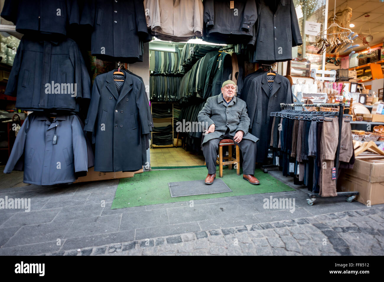 Gentlemen's outfitters and the owner in the Grand Bazaar of Istanbul, Turkey. Stock Photo