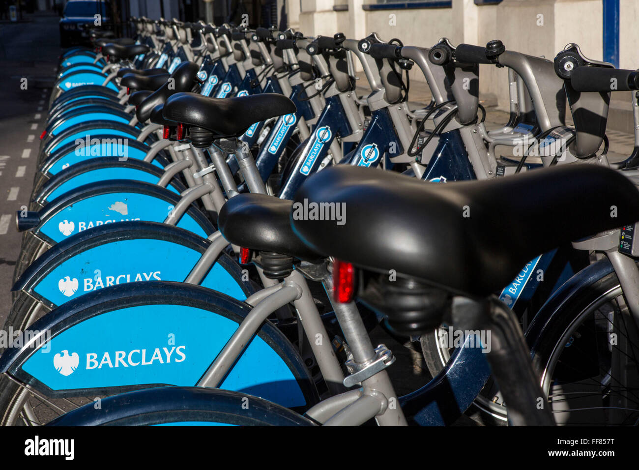 Bikes lined up in the Barclays cycle hire stand, Liverpool Street, London, United Kingdom. These bikes, often called Boris Bikes, after the mayor part of the Transport for London network. Stock Photo