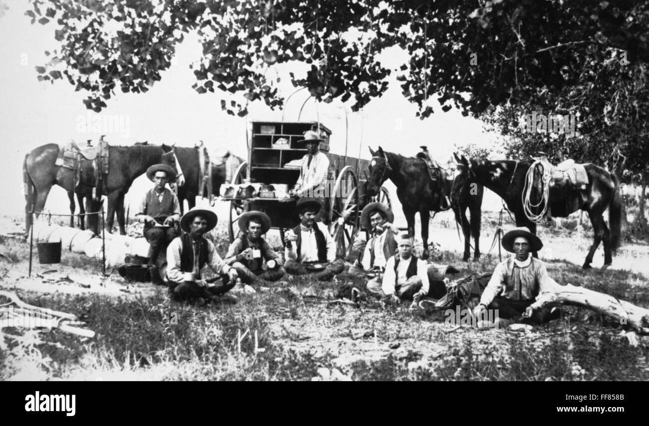 COWBOYS, c1885. /nCowboys eating at the chuckwagon in a camp in Western ...
