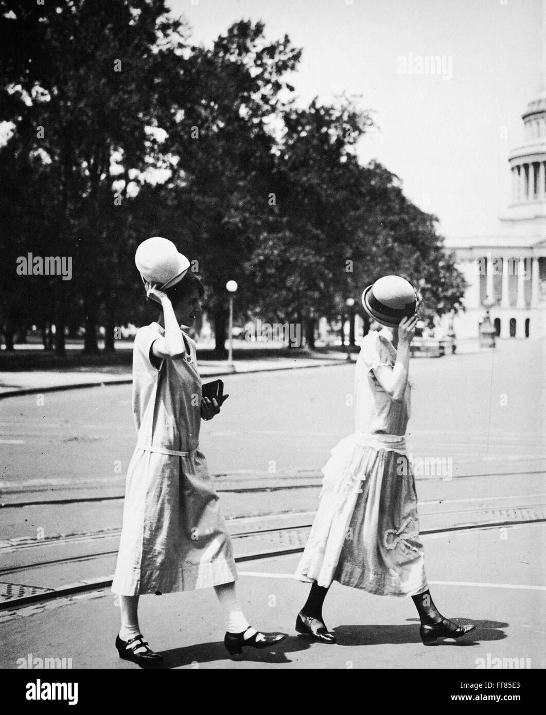WOMEN'S FASHION, c1920. /nTwo young campaigners for equal rights tipping their hats in Washington, D.C. Stock Photo