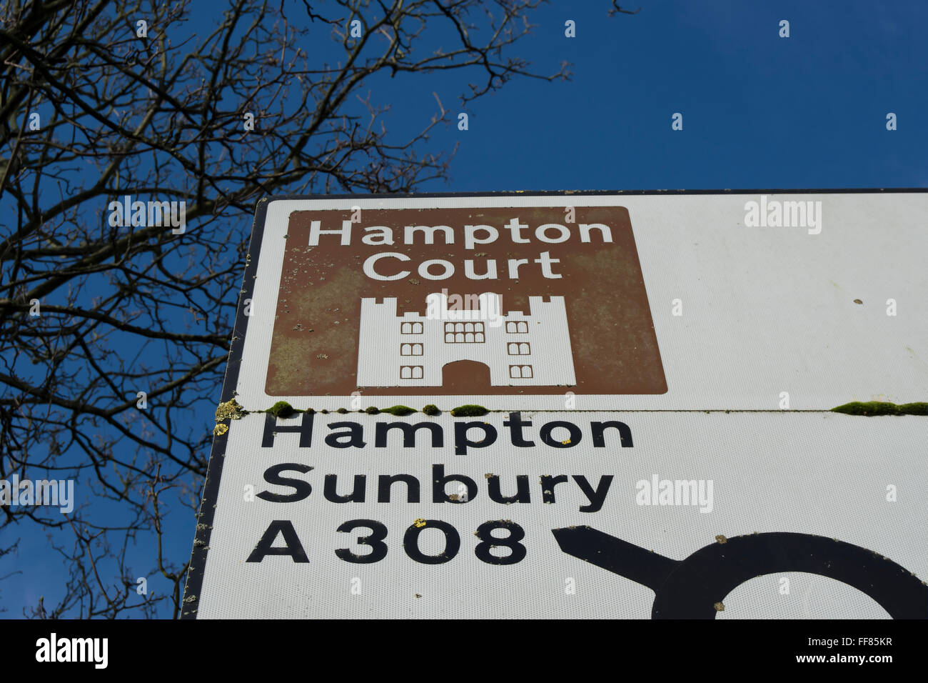 road sign giving directions to hampton court palace, and hampton
