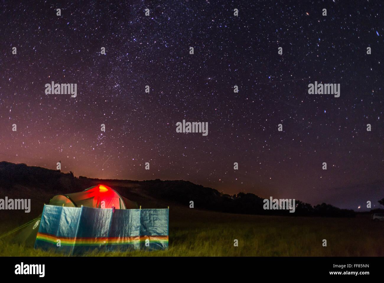 Camping underneath the stars on a clear night in the South Hams of Devon. Stock Photo