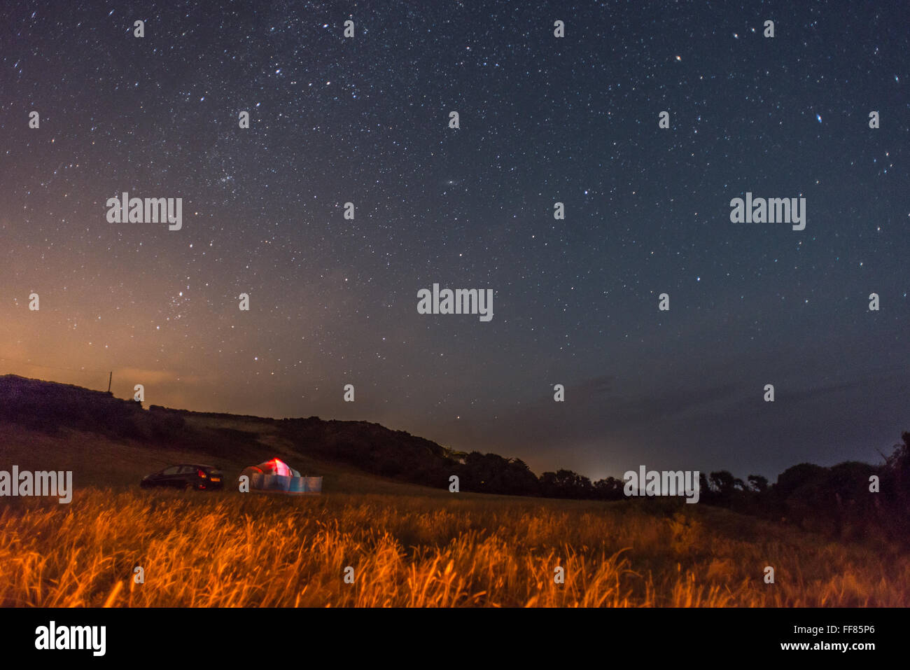 Camping underneath the stars on a clear night in the South Hams of Devon. Stock Photo