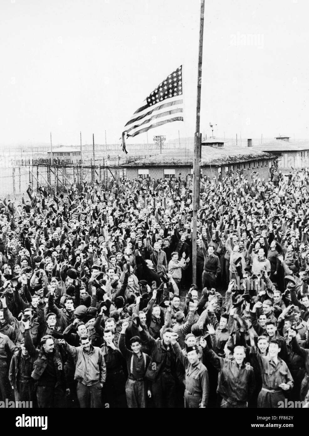 WORLD WAR II SOLDIERS. /nAmerican soldiers cheering the American flag