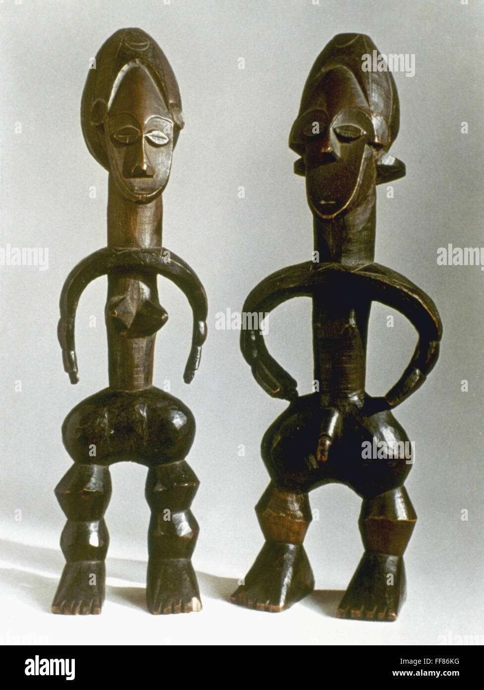 AFRICAN ART: FIGURINES. /nA pair of wooden figurines. Height: 35 and 34 cm. Stock Photo