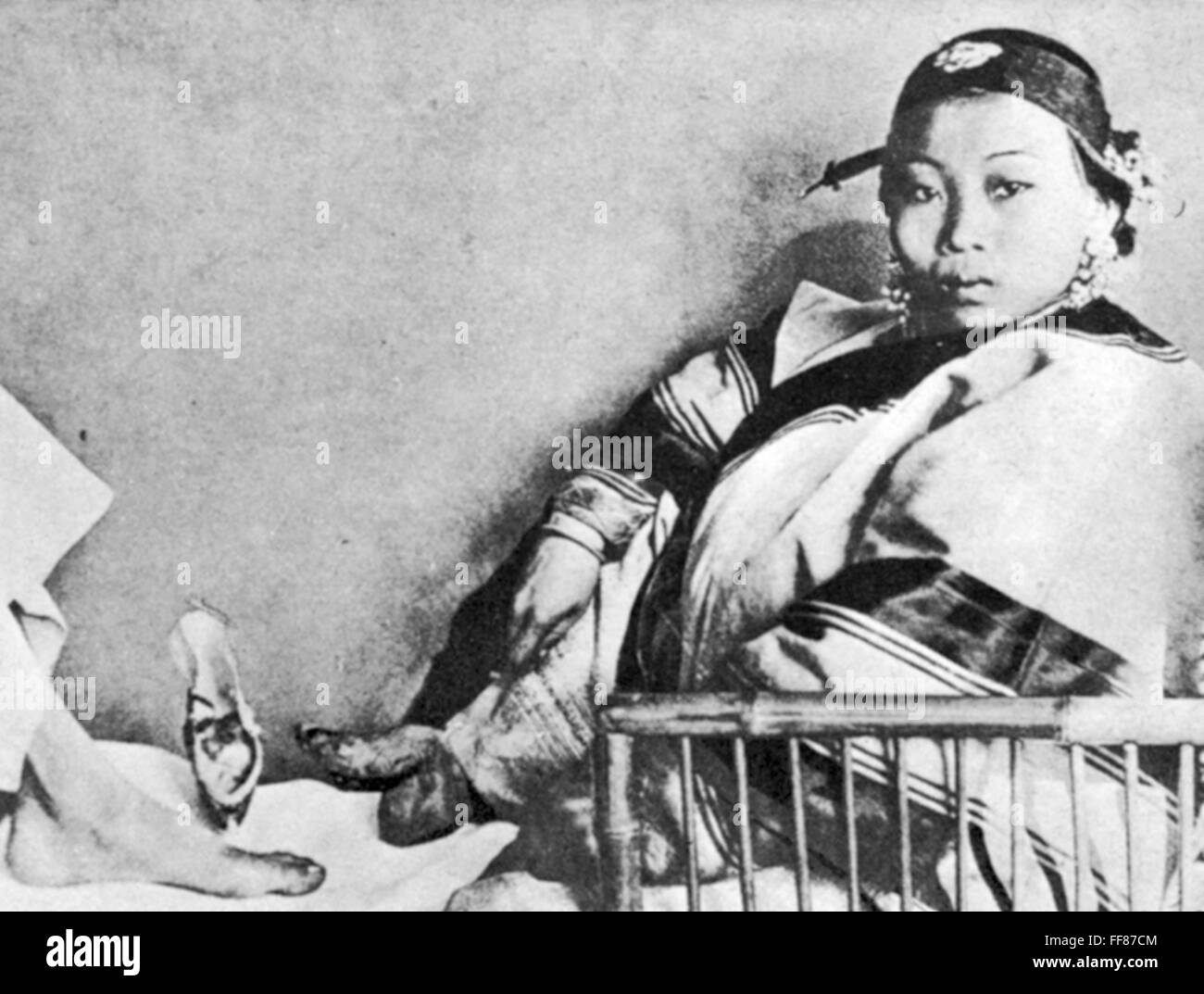 CHINA LILY FOOT, 1900. /nA 'lily footed' woman of China. Photograph