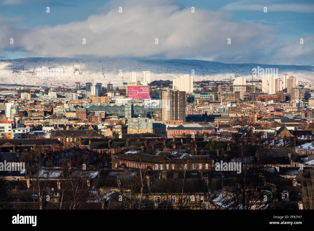 The view across Glasgow South side from Queens Park.  The park is known for its view across the south side of Glasgow, with a snow covered Campsie Fells in the background. Stock Photo