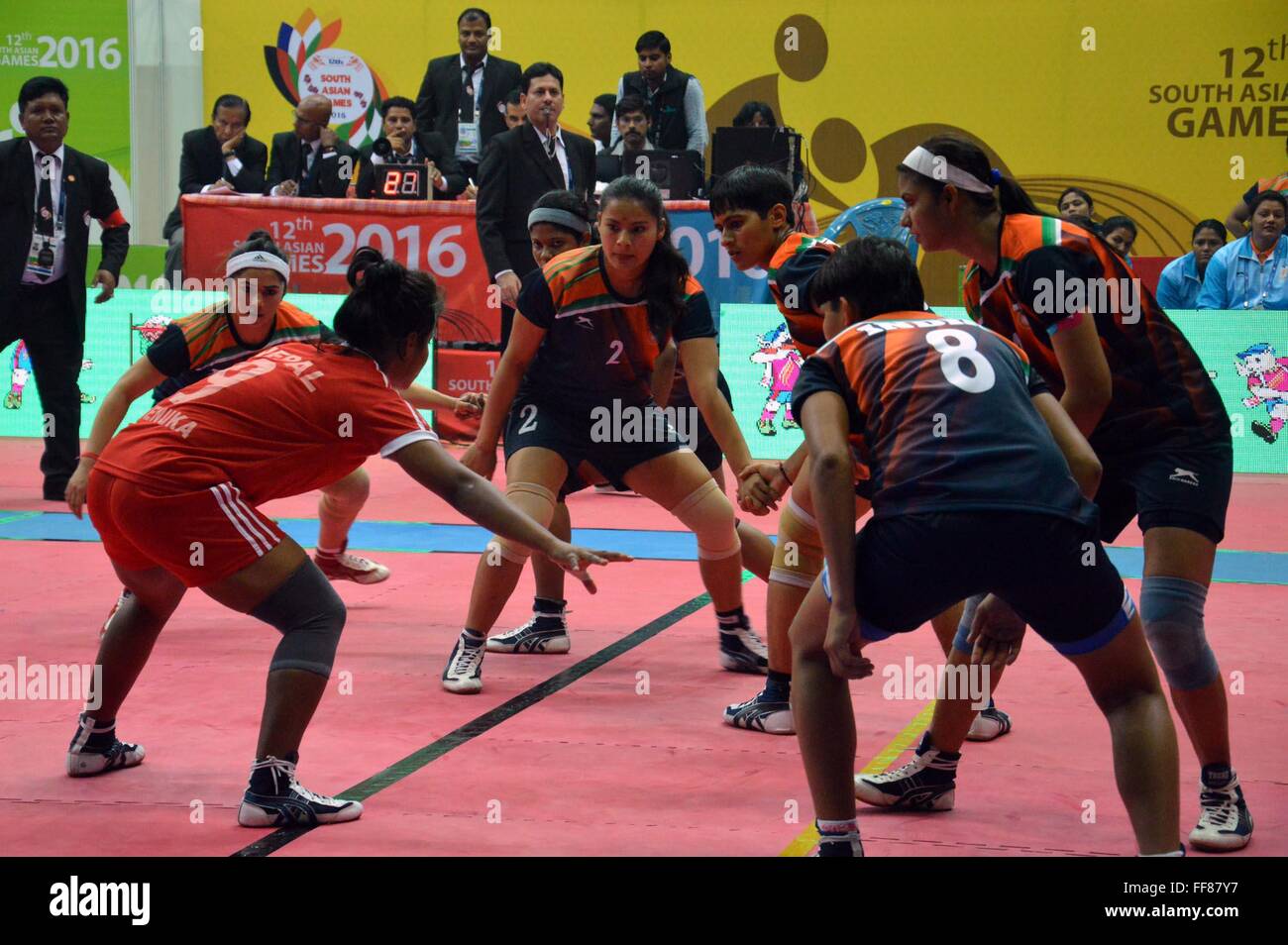 Guwahati, India. 11th February, 2016. An action moment of womens Kabaddi match played between India (blue) vs Nepal (Red) during 12th South Asian Games at D.T.R.P. Indoor Stadium in Guwahati on 11-02-16. Credit:  Abhijit Bose/Alamy Live News Stock Photo