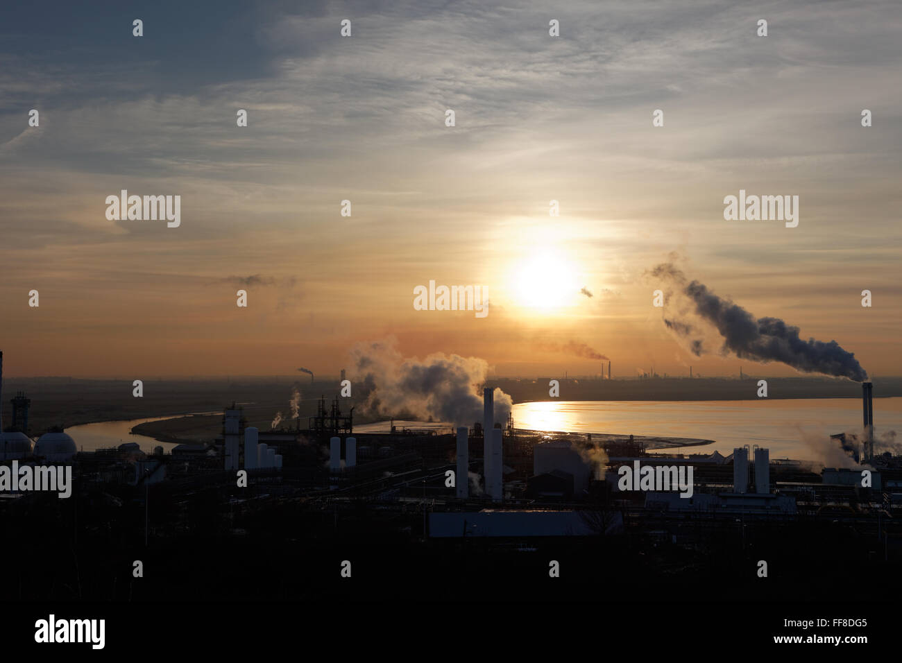 Landscape, industrial, smoking, chimneys, sunset, mersey, estuary, water, chemical, plant, pollution, environment,heavy industry Stock Photo