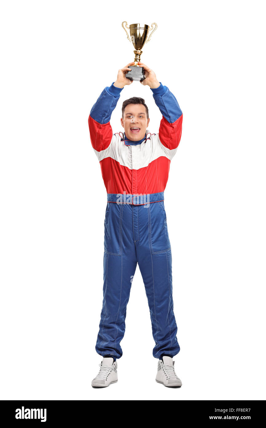 Full length portrait of a car racing champion holding a gold trophy above his head isolated on white background Stock Photo