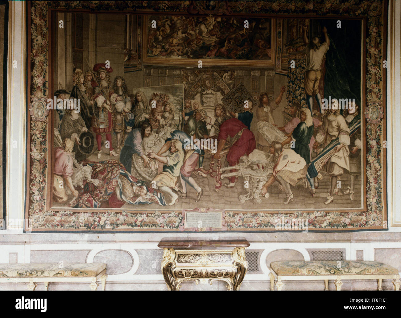 KING LOUIS XIV: TAPESTRY. /nKing Louis XIV of France and his Minister of Finance Jean-Baptiste Colbert visiting the Manufacture des Gobelins, the royal tapestry factory in Paris, 15 October 1667. Tapestry at the ChΓteau de Versailles, woven at the Gobelin Stock Photo