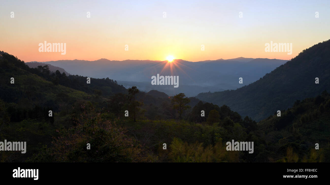 Sunset scene with silhouette mountain at Majonlung Chiangmai,Thailand Stock Photo