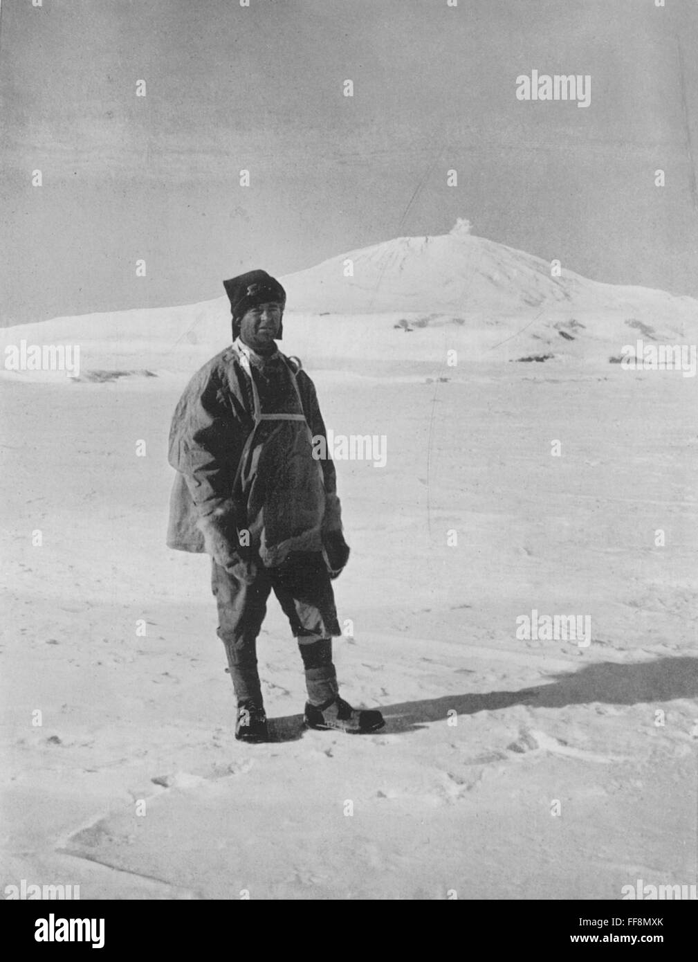 ROBERT FALCON SCOTT /n(1868-1912). English Antarctic explorer. Captain Scott, in the Antarctic with Mount Erebus in the background, on his 1910-1912 'Terra Nova' expedition. Photograph by Herbert Ponting. Stock Photo