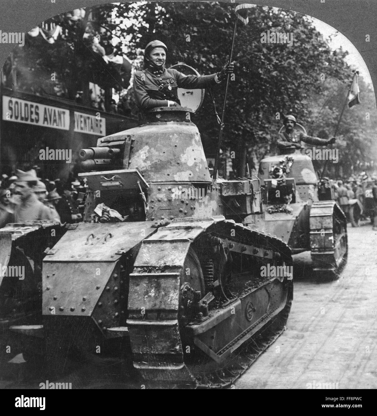 WORLD WAR I FRENCH TANK. /nFrench tank parading through the streets of