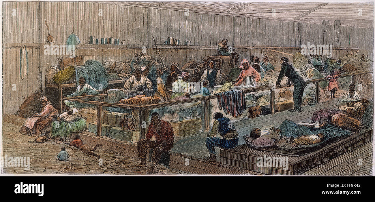 KANSAS: BLACK EXODUS, 1879. /nBlack migrants from the American South in one of the buildings at Topeka, Kansas, used as a terminus of the exodus to the North and West following the end of Reconstruction. Colored American wood engraving, 1879. Stock Photo