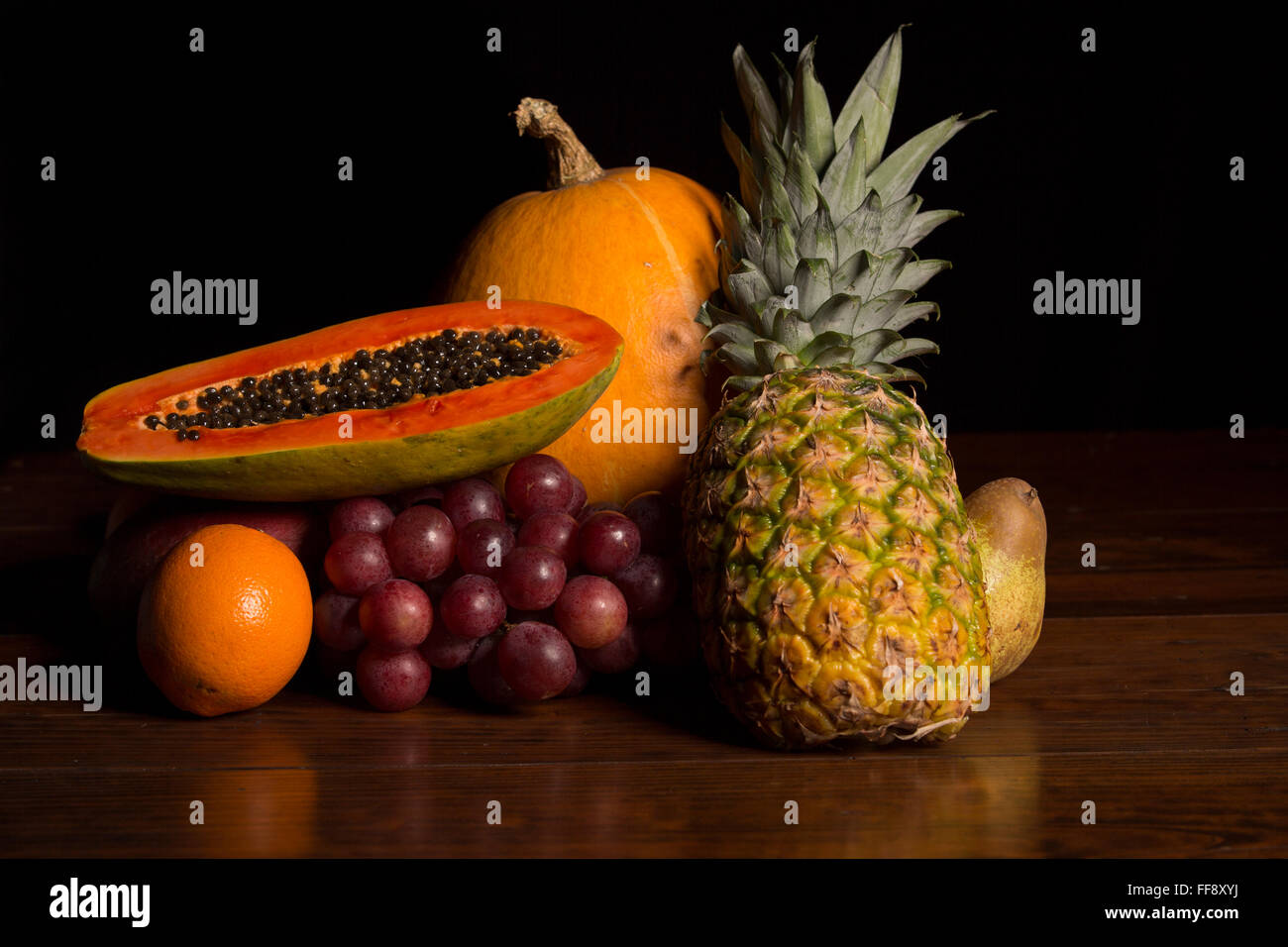 variety of fruits on a wooden table, studio picture Stock Photo - Alamy
