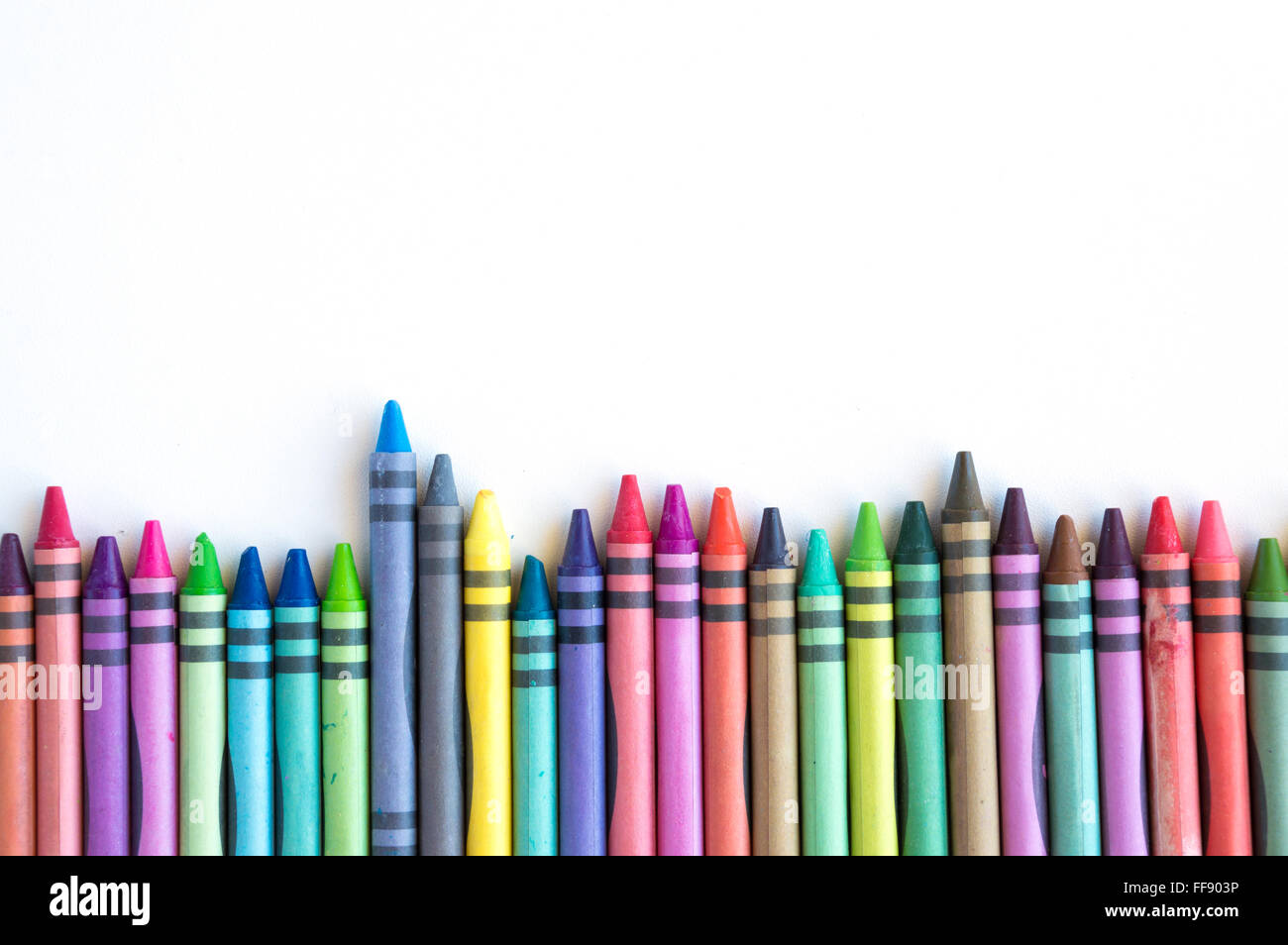 Crayons and pastels spread isolated on white background Stock Photo
