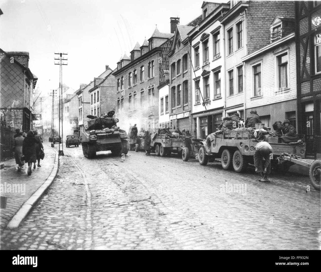 WWII: BELGIUM, 1944. /nEuropean Ground Combat. Tanks of the American First Army in the streets of Malmedy, Belgium, moving to help stem the strong German counter-offensive in the area, December 1944. Stock Photo