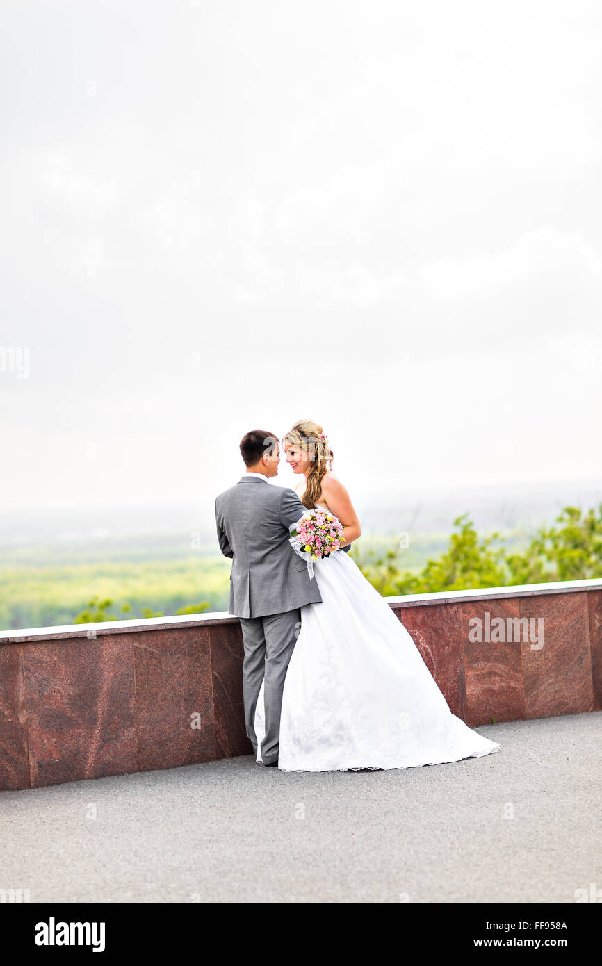 Young wedding couple enjoying romantic moments Stock Photo - Alamy