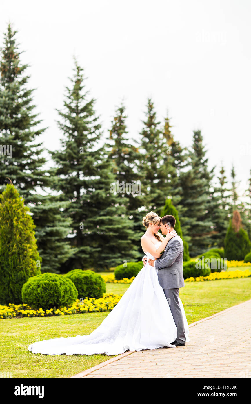 Young wedding couple enjoying romantic moments Stock Photo - Alamy